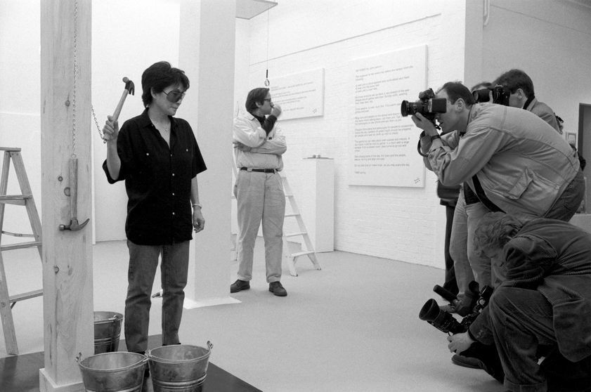 Yoko Ono, installing 'In Facing' exhibition at Riverside Studios, 1990 by Edward Woodman © Edward Woodman. All rights reserved, DACS/Artimage 2018 Yoko Ono, installing 'In Facing' exhibition at Riverside Studios, 1990