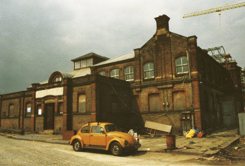 Freeze Building, outside Port London Authority building with Michael Landy's car, Surrey Docks, London 1988 by Abigail Lane © Abigail Lane. All Rights Reserved, DACS/Artimage 2018. Photo: Abigail Lane Freeze Building, outside Port London Authority building with Michael Landy's car, Surrey Docks, London 1988