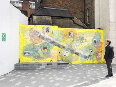 Jeffrey Dennis by his public artwork 'The Luton Host', 2017